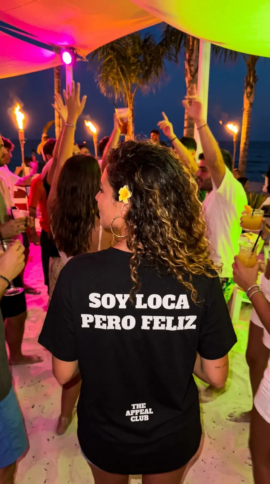 Person from behind at a beach party