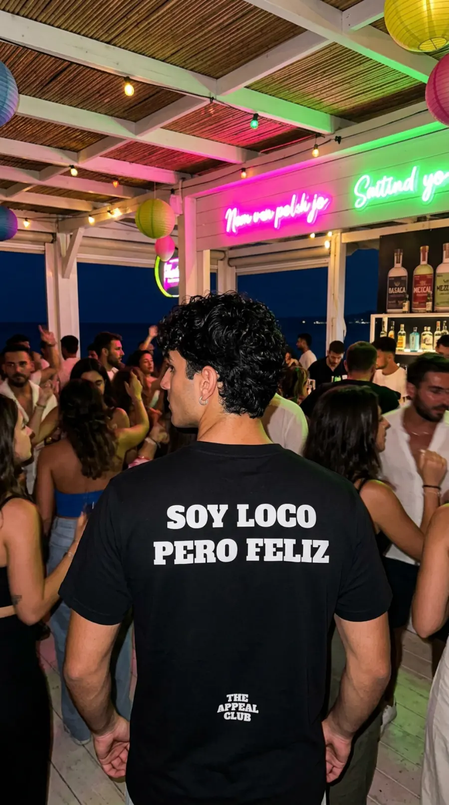 Person from behind at a seaside venue